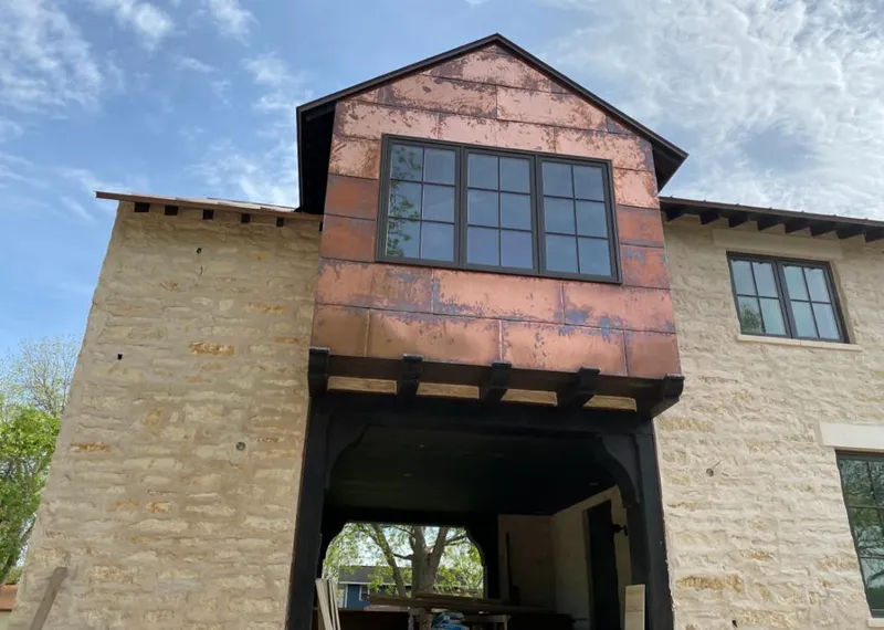 Copper metal panel facade on a stone building for Skylight Installation in Oakland Park