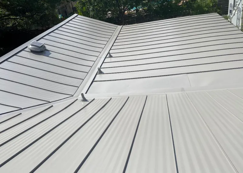 Solar attic fan installed on a metal roof for Roof Ventilation in Oakland Park